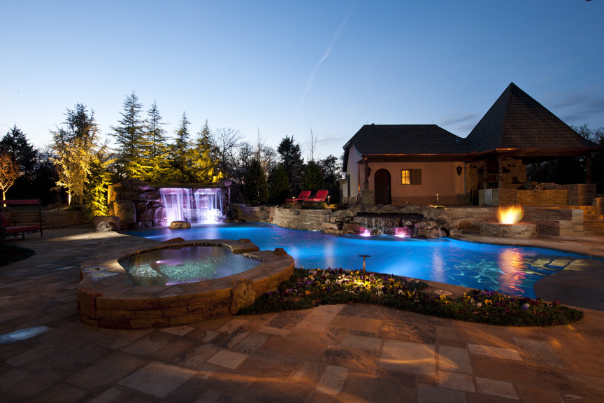 Nicely lit swimming pool and surroundings