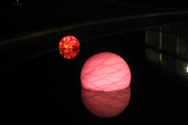 Floating pool light at night.