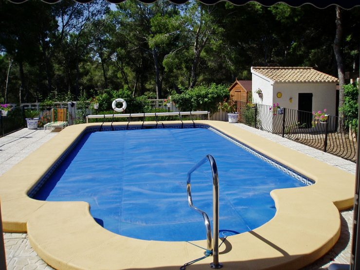 backyard pool with cover