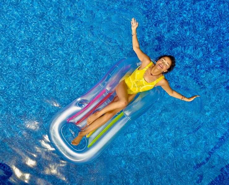 Relaxing on a pool float in the swimming pool