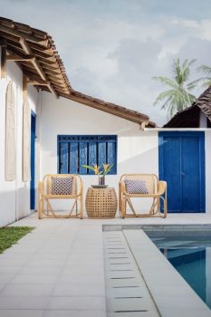 House with pool and chairs