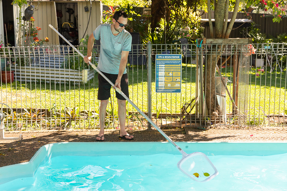 removing debris from pool
