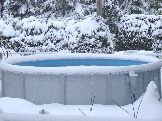 Frozen above ground swimming pool.