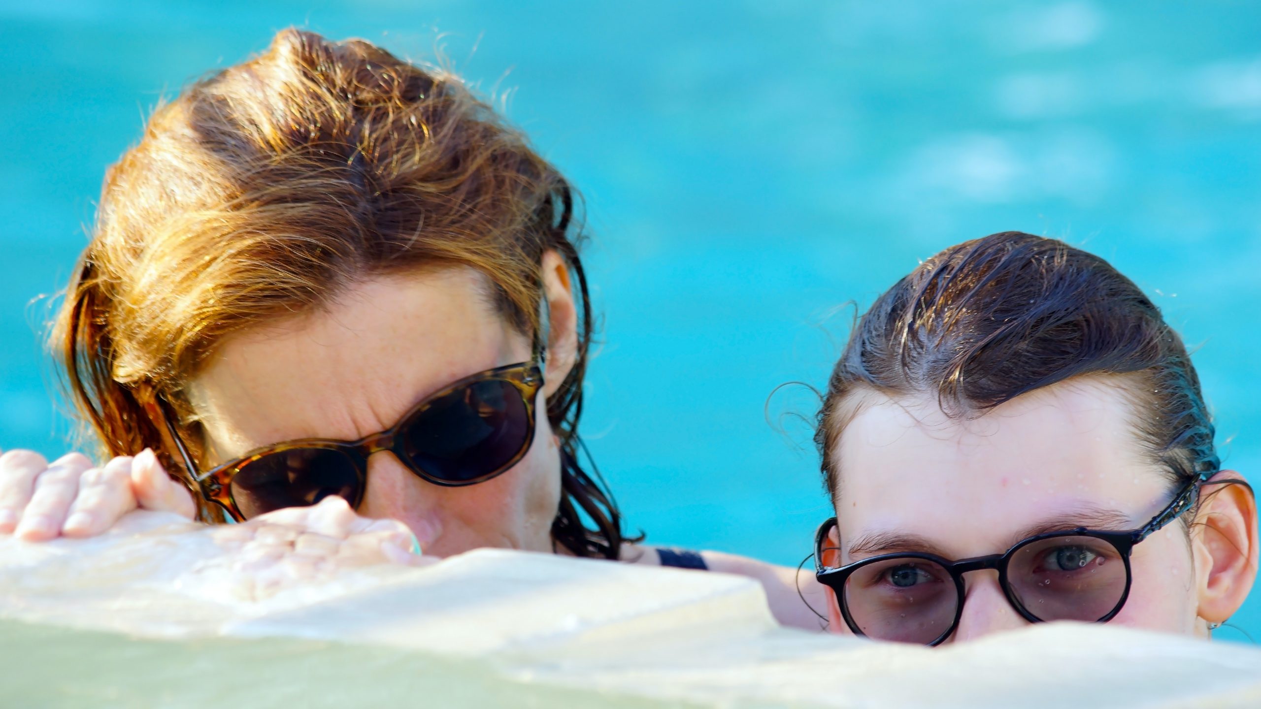 swimming in the pool with glasses on