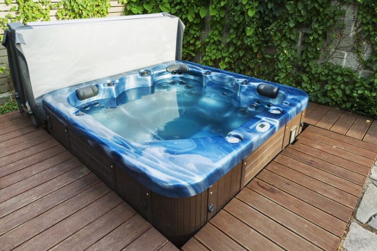 Hot tub in backyard with deck