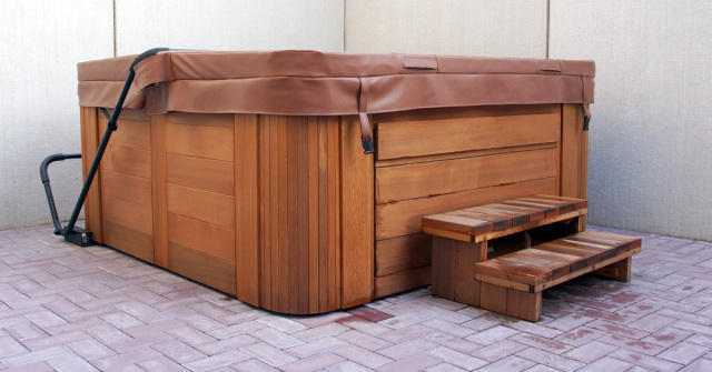 outdoor hot tub with brown leather cover on