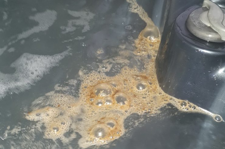 Brown biofilm in the spa or hot tub.