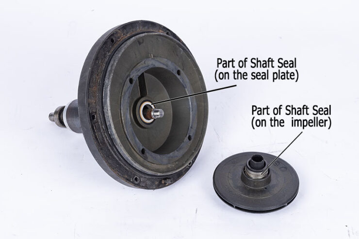 Pump seal plate with shaft seal. Impeller on right with shaft seal.