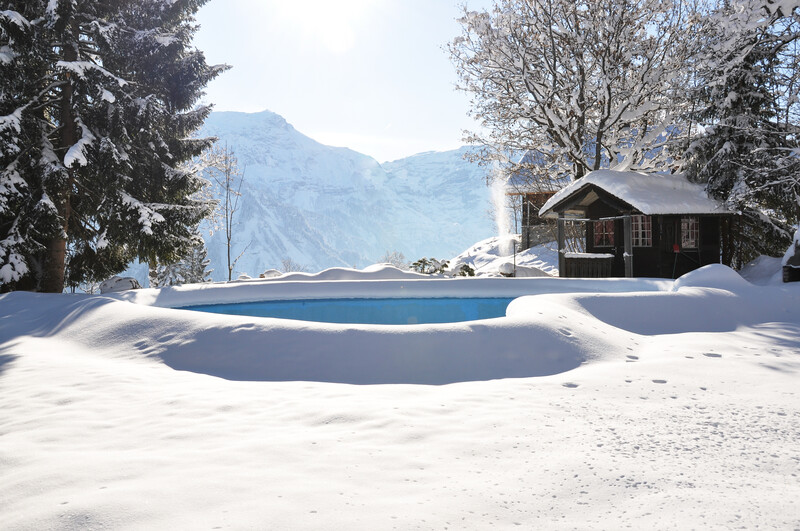 snow surrounding pool