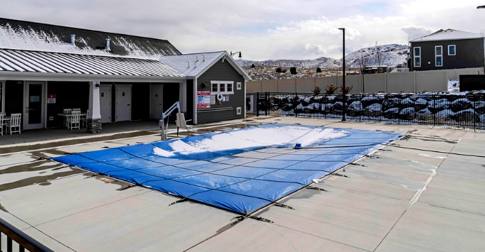 snow on pool cover during winter season