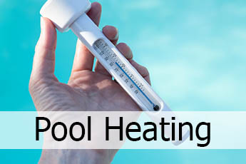 Man's hand holding a floating swimming pool thermometer to depict swimming pool heating.